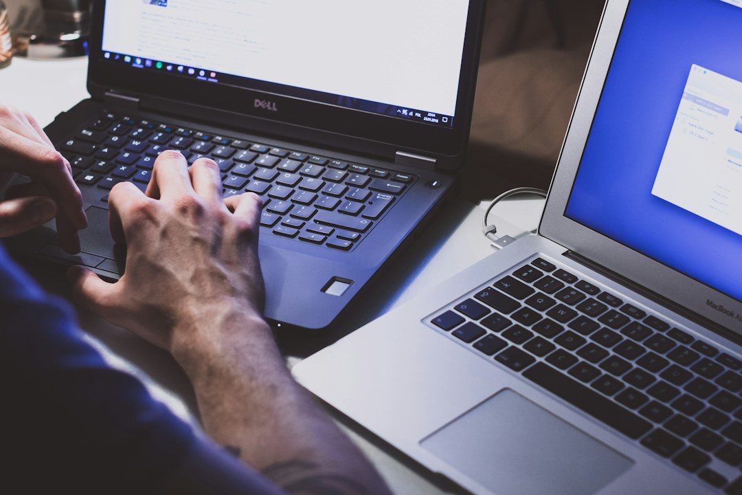 Person using a laptop while troubleshooting a Windows PC